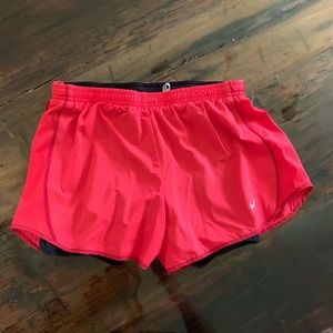 Red Nike running shorts